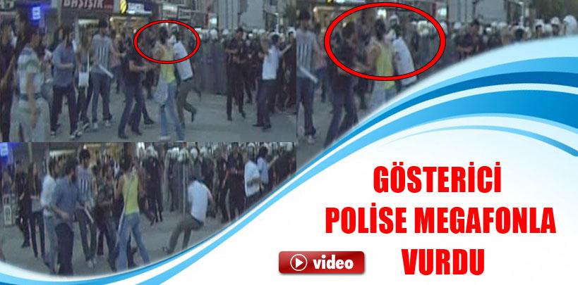 Gösterici polise megafonla vurdu