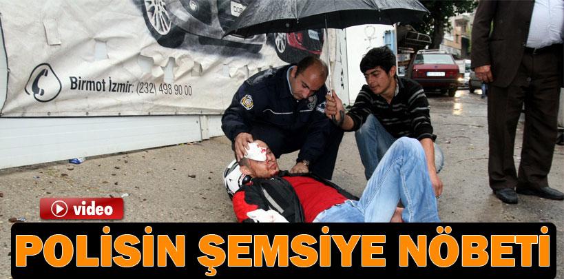 Polisin yaralı başında şemsiyeli nöbeti